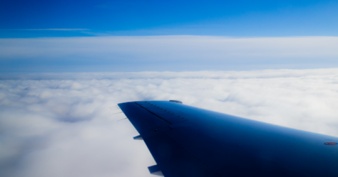 Plane wing in clouds