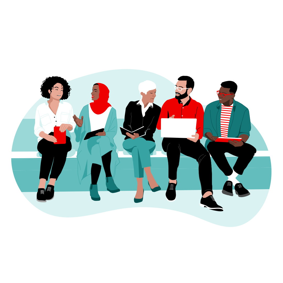 Multiple people sit shoulder-to-shoulder in discussion with various technology hardware in their hands and laps